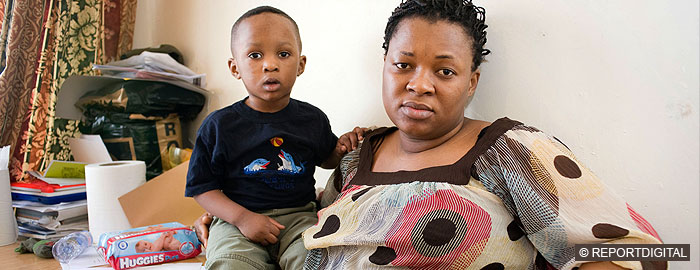 Black woman with young boy at home