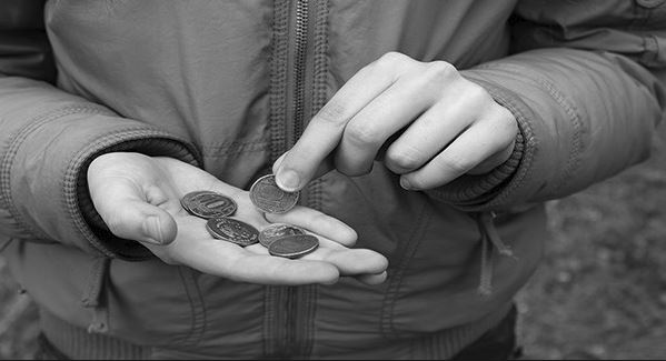 Hands with money change in them