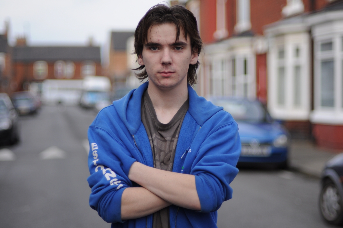 Unemployed young man Marc standing in street