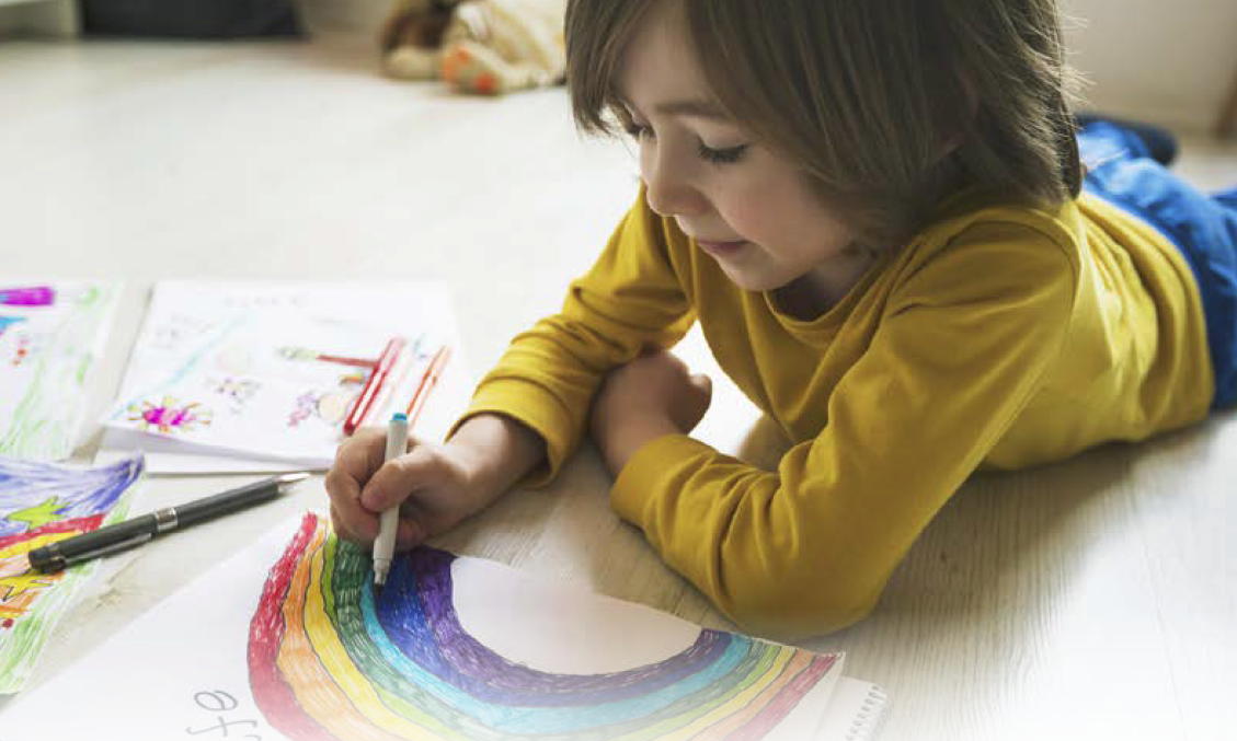 Child drawing rainbow from JRF 2020/21 report front cover
