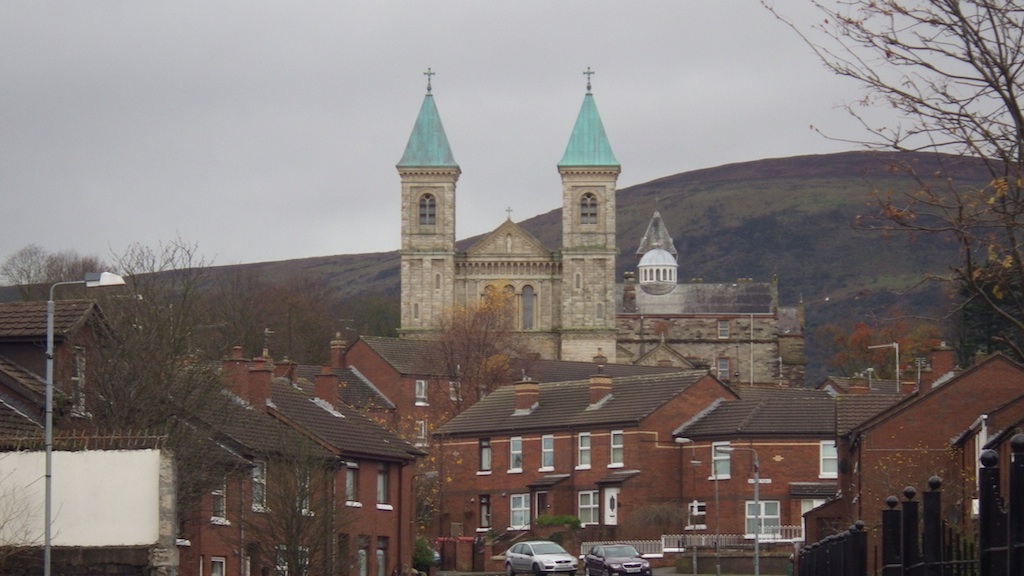 houses with church in background