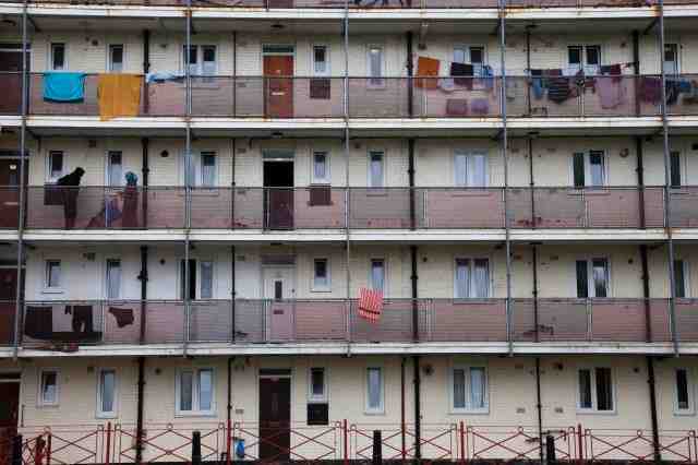 Landings of flats with balconies, 1960s style, in run-down estate.
