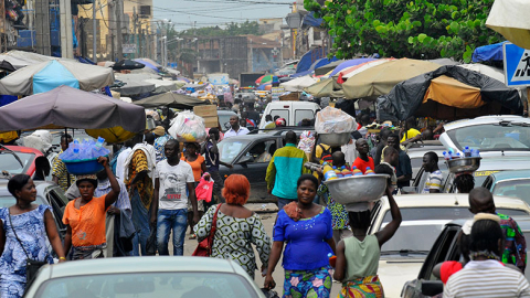 Benin street with traders and cars