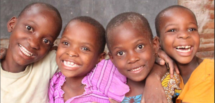 Four children smiling, Uganda, UNICEF