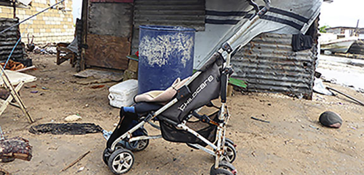 Pram by shack, Tonga poverty