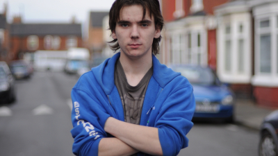 Unemployed young man Marc standing in street