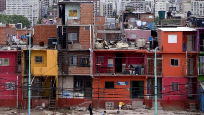 Poor housing in Buenos Aires with high rises in background 2017